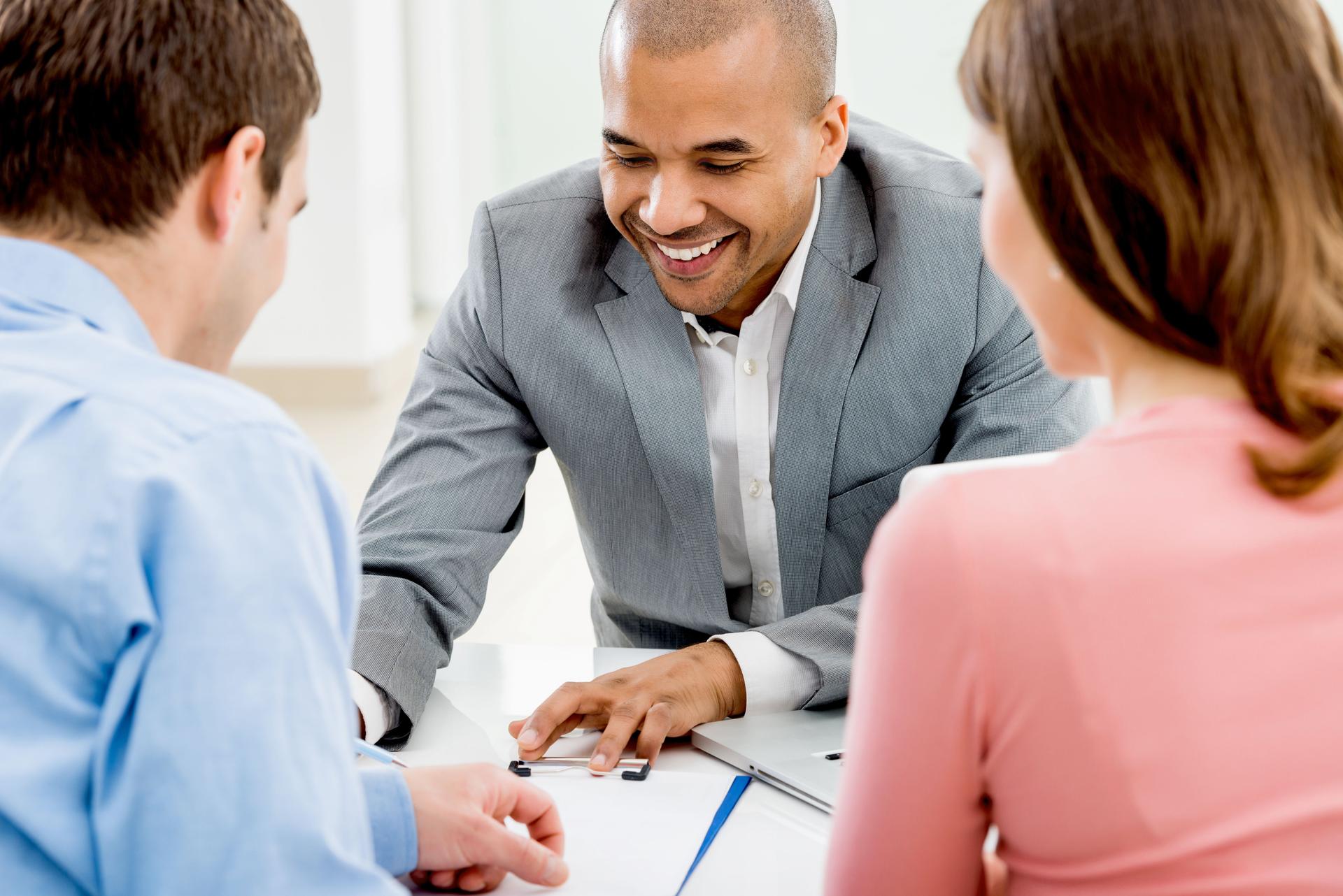 Couple meeting with their financial advisor.